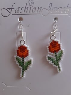 the earrings are made out of legos and have a flower on each earring