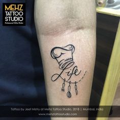 a tattoo on the arm of a person with a knife and fork in it's hand