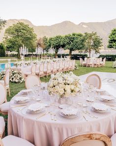 a table set up for an outdoor wedding reception