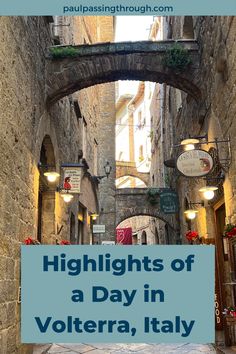 an alleyway with the words highlights of a day in volterra, italy