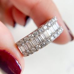 Crafted from gleaming 14k white gold, the band exhibits a scintillating row of baguette diamonds along the top framed by two rows of twinkling round diamonds. 14K White Gold Diamond 1.50CT H color and SI2 in clarity. 5.8gm Size 7.75 sizing available with fee contact us to have it added to the price before checkout. Thank you for visiting our shop! Visit our website DmKJewelry.com Also Follow us on Instagram https://www.instagram.com/dmkjewelry_/ 𝑫𝑴𝑲 𝑱𝒆𝒘𝒆𝒍𝒓𝒚 Each order will be beautiful Round Diamond Band, Baguette Diamond Rings, Diamond Jewel, Baguette Diamonds, Jewelry Lookbook, Baguette Diamond, Diamond Bands, White Gold Diamonds, Round Diamond