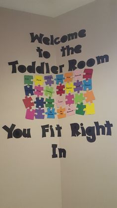 a welcome sign for the toddler room you fit right in with puzzle pieces on it