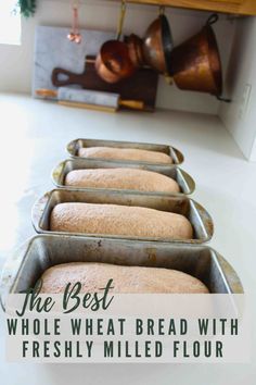 the best whole wheat bread with freshly milled flour in pans on a counter