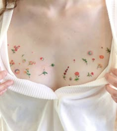 a woman with flowers painted on her chest