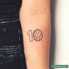 a woman's arm with a tattoo that has a volleyball ball on it and the number ten