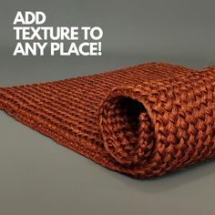 an orange knitted tie with the text add texture to any place