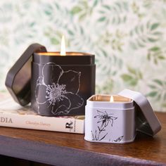 a candle and some books on a table