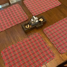 red and black plaid placemats on a wooden table