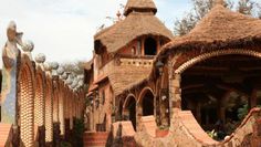 an elaborately designed building with stone walls and steps