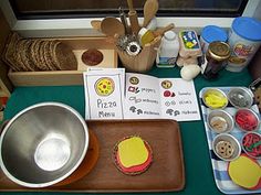 a table topped with lots of food and cooking utensils