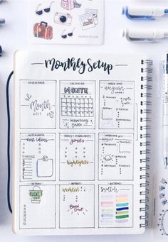 an open planner with the words month - by - step written on it next to pens and markers