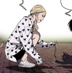 a woman kneeling down next to a black cat on top of a brick road with speech bubbles above her