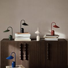 a table with some books and lamps on it