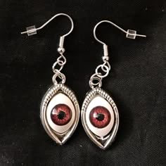 "This is a pair of silver earrings with eerily realistic brown glass eyeballs, that seem to always be looking at you. They are a really fun and a little spooky! Hung on fish hook ear wires, they are 2\" long, and just over 1/2\" wide. Make sure to check out my shop for more hair pins, jewelry, earrings, accessories, and all sorts of fun stuff!" Strange Earrings, Eyeball Jewelry, Spooky Accessories, Eyes Creepy, Spooky Items, Eyeball Earrings, Creepy Earrings, Spooky Jewelry, Eyes Jewelry