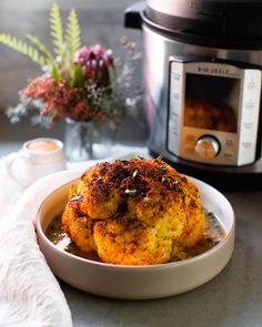 some food in a bowl next to an instant pot