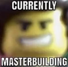 a lego man wearing a hat with the words currently masterbuilding