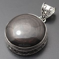 MASSIVE Grey Obsidian Gemstone Pendant Necklace Pendant Gemstone Vintage Style Pendant Gift For Her Sterling Silver Plated Jewellery Gift For Him Materials Sterling Silver Plated Pendant Size 2.2 x 1.5 Stone Name MASSIVE Grey Obsidian Color- Black Shipping Policy We do ship through DHL, UPS, INDIA POST. I make the gemstones myself for my valued customers so I assure you that the gemstones are Natural and are made from ethically sourced roughs. The rest of the pendant is made from 925 Sterling si Obsidian Color, Gemstone Pendant Necklace, India Post, Silver Plated Jewelry, Jewellery Gift, Gemstone Necklace Pendant, Necklace Pendant, Gemstone Pendant, Gift For Him