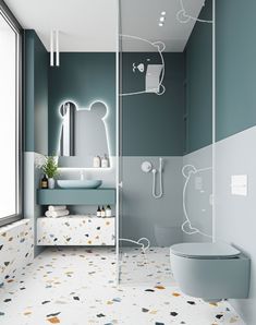 a bathroom with a toilet, sink and shower in it's center wall is painted teal