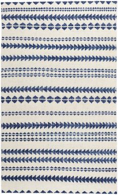 a blue and white rug with an arrow pattern