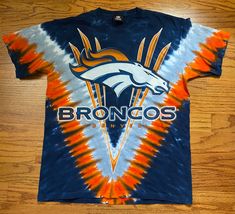 🏈 FREE SHIPPING 🏈 Vintage early 00s Denver Broncos all over tie dye with big bronco graphic on front and helmet on back.  awesome navy and orange color scheme.  in excellent condition with little to no flaws  size M Nfl Broncos, Orange Color Schemes, Navy And Orange, Early 2000’s, Charlottesville Va, Tie Dye Shirt, Denver Broncos, Color Scheme, Denver