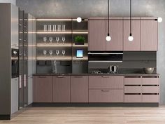 a modern kitchen with stainless steel appliances and wood flooring