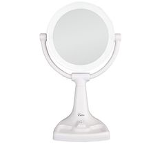 a small white mirror on top of a stand