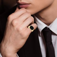 The epitome of class… A sleek gold ion-plated men's ring featuring a smooth black onyx center stone.The simple and classy design is perfect for any well-dressed gentleman.This durable stainless steel ring is the perfect statement piece; whether it's for everyday wear, or on your pinky for a special occasion.Designed for greatness, this ring will inspire you to make your own legacy. Pinky Ring Mens, Military Jewelry, Mens Pinky Ring, Pearl And Diamond Necklace, Romantic Gifts For Her, Silver Bullion, Classy Design, Jewelry Catalog, Diamond Jewelry Necklace