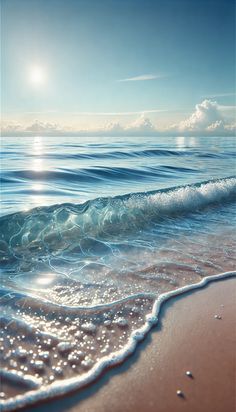 the sun is shining over the ocean waves on the beach with clear blue skies and white clouds