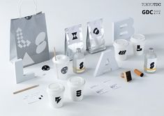 an assortment of items are displayed on a white surface with the letters and numbers cut out