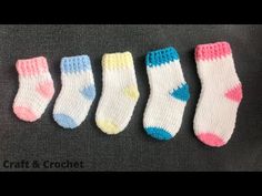 five pairs of socks are lined up on a table with the words craft and crochet written below them