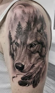 a man with a wolf tattoo on his arm