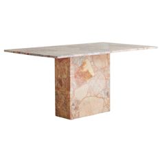 a marble dining table with a square base