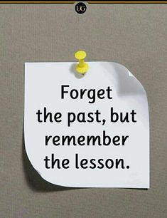 a piece of paper with the words forget the past, but remember the lesson on it