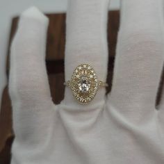 a close up of a person's hand with a ring on top of it