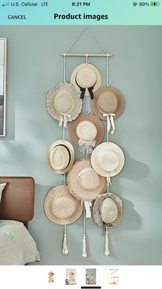 a wall mounted hat rack with hats hanging from it's sides and the caption below