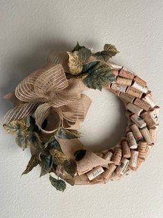 a wreath made out of wine corks and leaves