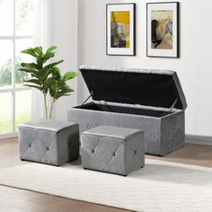 a large gray storage box sitting on top of a rug next to two stools