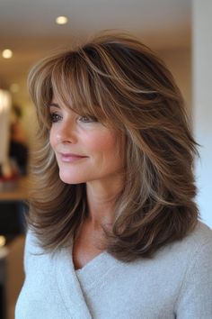 25 Very Layered Hair Medium Over 50 Styles Long Bob With Feathered Layers, Over 50 Layered Hairstyles, Over 50 Shoulder Length Hairstyles, Hair Styles With Layers Medium, Shoulder Length Bob With Bangs Over 50, Med Shag Haircut Over 50, Layered Hair Shoulder Length Choppy, Light Bangs Wispy Face Framing, Butterfly Haircut Over 50