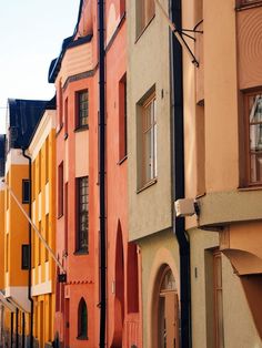 a row of multicolored buildings next to each other