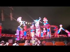 an amusement park at night with lights and decorations