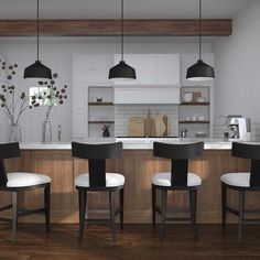 an image of a modern kitchen setting with bar stools and island in the middle