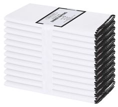 a stack of white napkins on top of each other