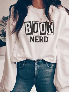 Here it is, the perfect gift to your favorite bookworm! Book Nerd sweatshirt can be found in the following colors: Black (White Design) White (Black Design) Forest (White Design) Ash (Black Design) Dark Heather (White Design) Sand (Black Design) Red (White Design) If you would prefer a different color combination, please message the shop! These are a Unisex Crewneck Sweatshirts (NOT woman's) and a relaxed/ looser fit. (size chart available in the photo section of this listing) *Available in adul Book Nerd Sweatshirt, Book Worms Aesthetic Outfit, Book Nerd Aesthetic Outfit, Bookish Outfits, Book Sweatshirts, Bookclub Gifts, Book Worm, Book Shirts, Heather White