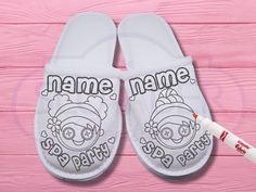 a pair of slippers with the word name on them and a marker next to it