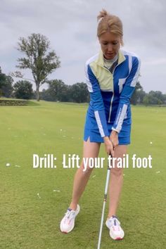 a woman in blue and white is playing golf on the grass with words that read drill lift your trail foot