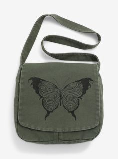 Flutter through your day with your essentials tucked away in this messenger bag! It comes in a forest green and features a central print of a skeletal butterfly. Comes with a front flap with two drop pockets at the front and an interior zipper pocket. Skeletal Butterfly, Academia Bag, Dark Academia Bag, Bag Dark Academia, Gothic Backpacks, Cute Messenger Bags, Cottagecore Bag, Gothic Mode, Disney Valentines