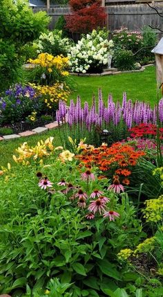 a garden filled with lots of colorful flowers