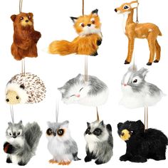 an assortment of stuffed animals hanging from strings