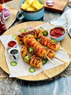 korean corn dog recipe with ketchup and pickles on a wooden platter