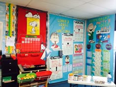 a classroom with posters on the wall and desks